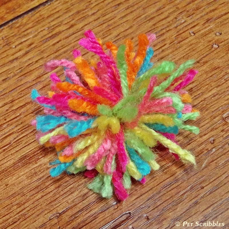 Make a pom-pom with leftover yarn scraps...